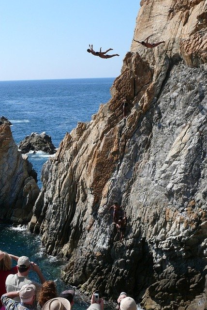 acapulco, la quebrada, rock, jumping into water, water, ocean, sea, nature, flight